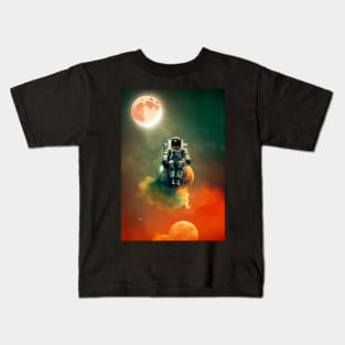 Astronaut sitting on a moon with red clouds in space with moons in the background Kids T-Shirt